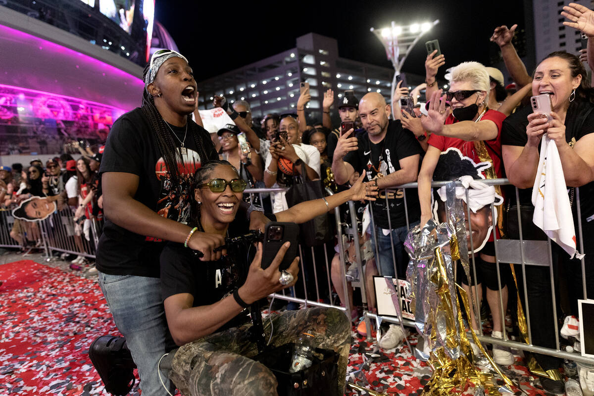 Las Vegas Aces guard Chelsea Gray (12) and Las Vegas Aces guard Sydney Colson (51) visit their ...