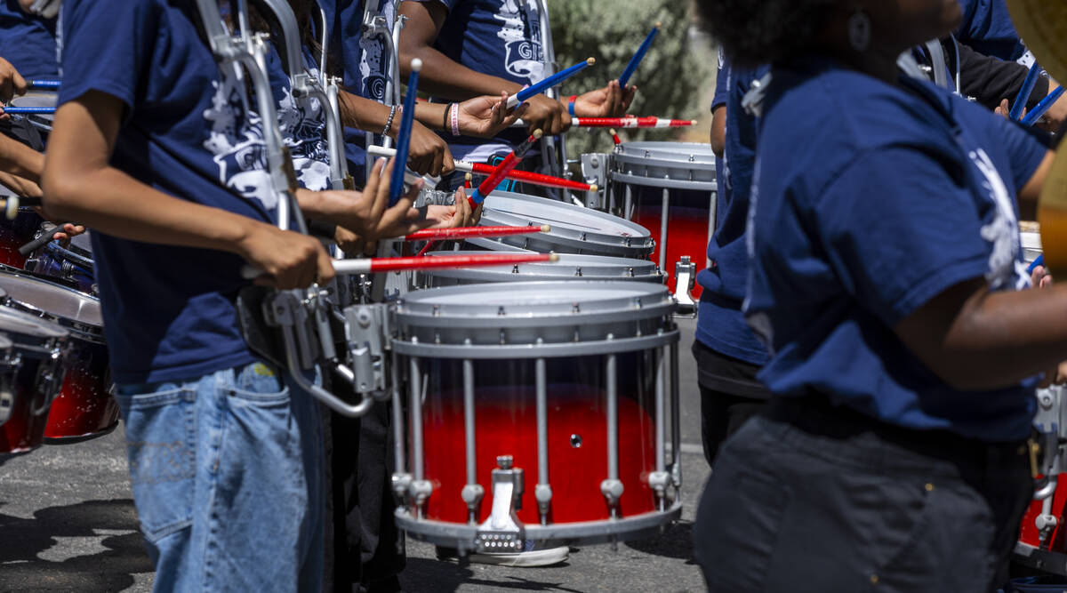 Band members with the Robert O. Gibson Leadership Academy perform for the crowd along the route ...