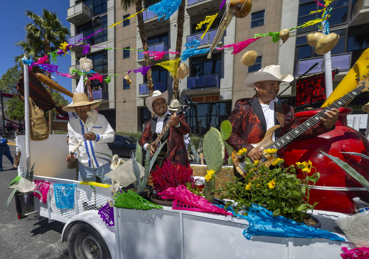 Members of Federacion Hidalguense de Nevada perform for the crowd along the route during the He ...