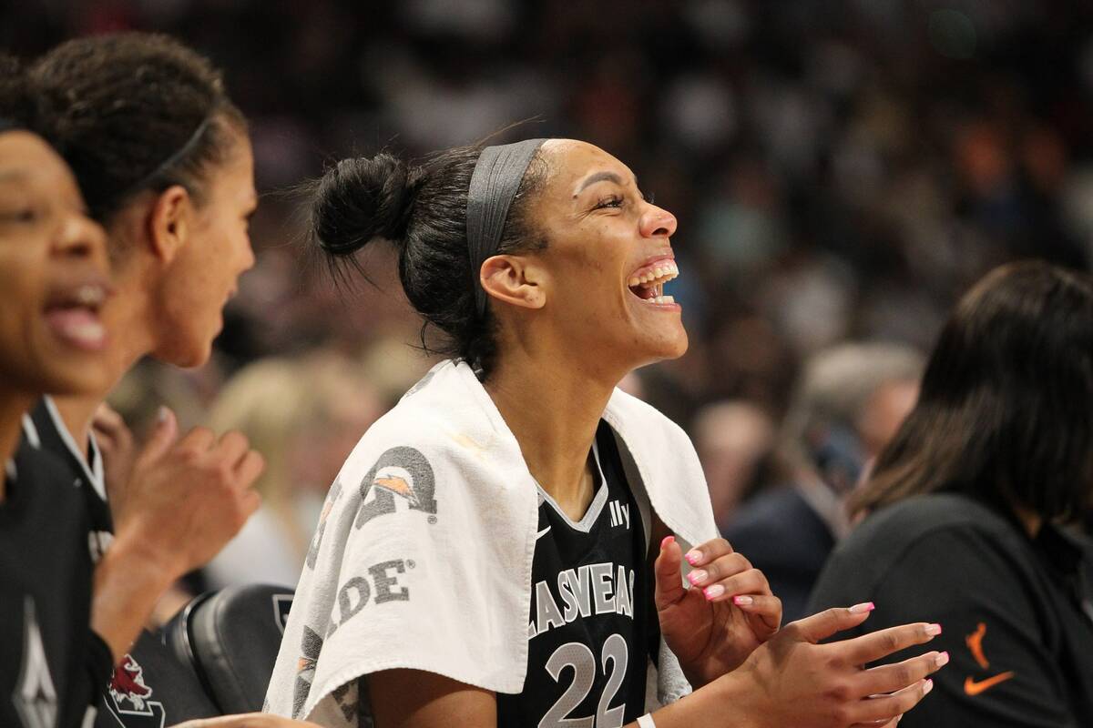 A'ja Wilson laughs on the bench during the Aces' game against the Puerto Rico national team on ...