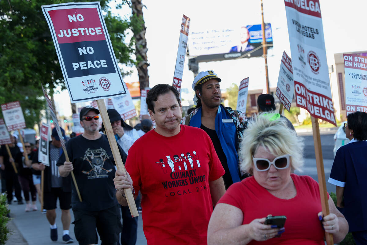 Demonstrators, including Nevada Secretary of State Cisco Aguilar, center left, protest on the s ...