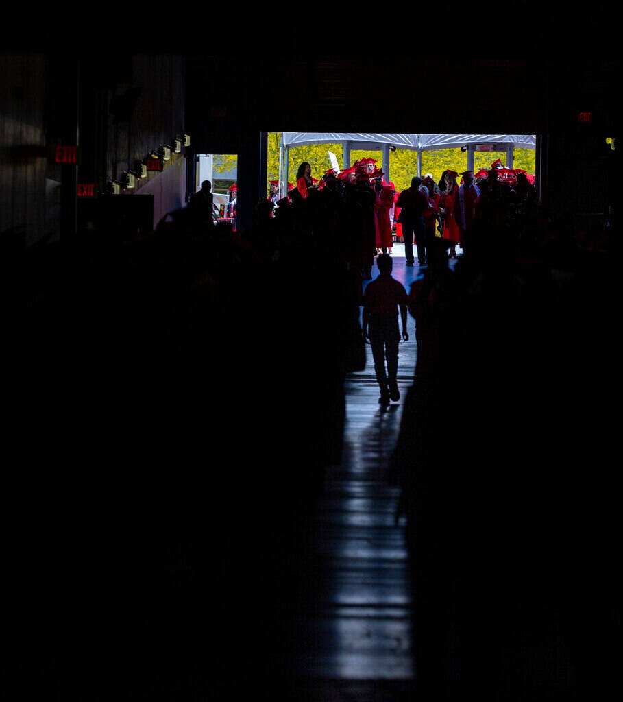 Graduates line up to enter the arena during UNLV spring graduation commencement exercises at th ...