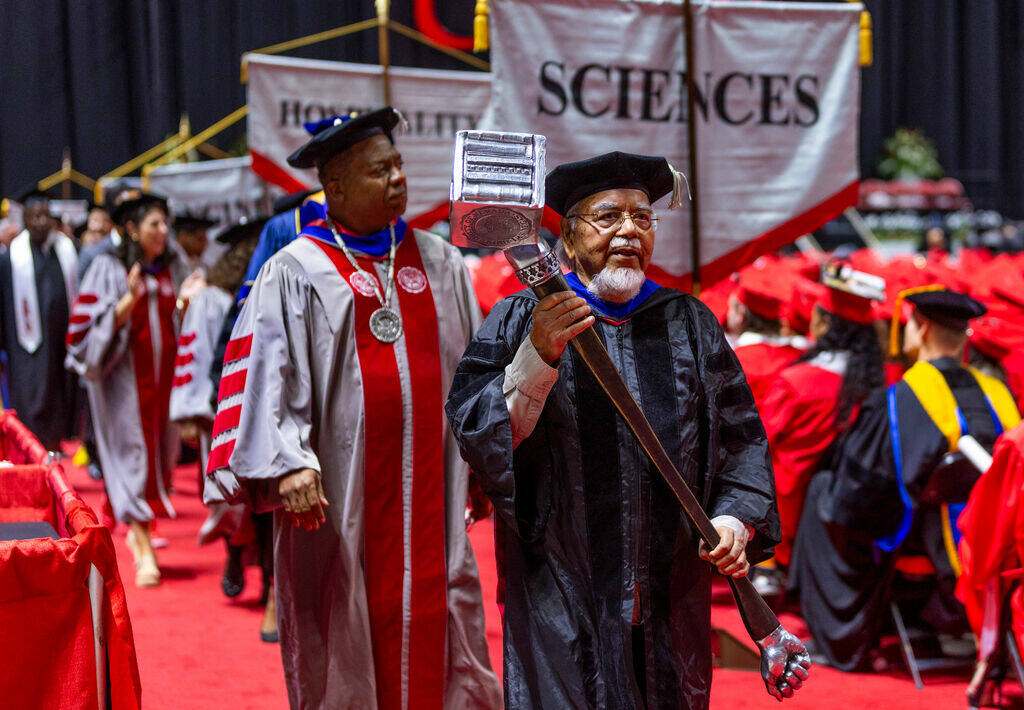 The "backbone party" of senior administrators arrive during UNLV spring graduation co ...
