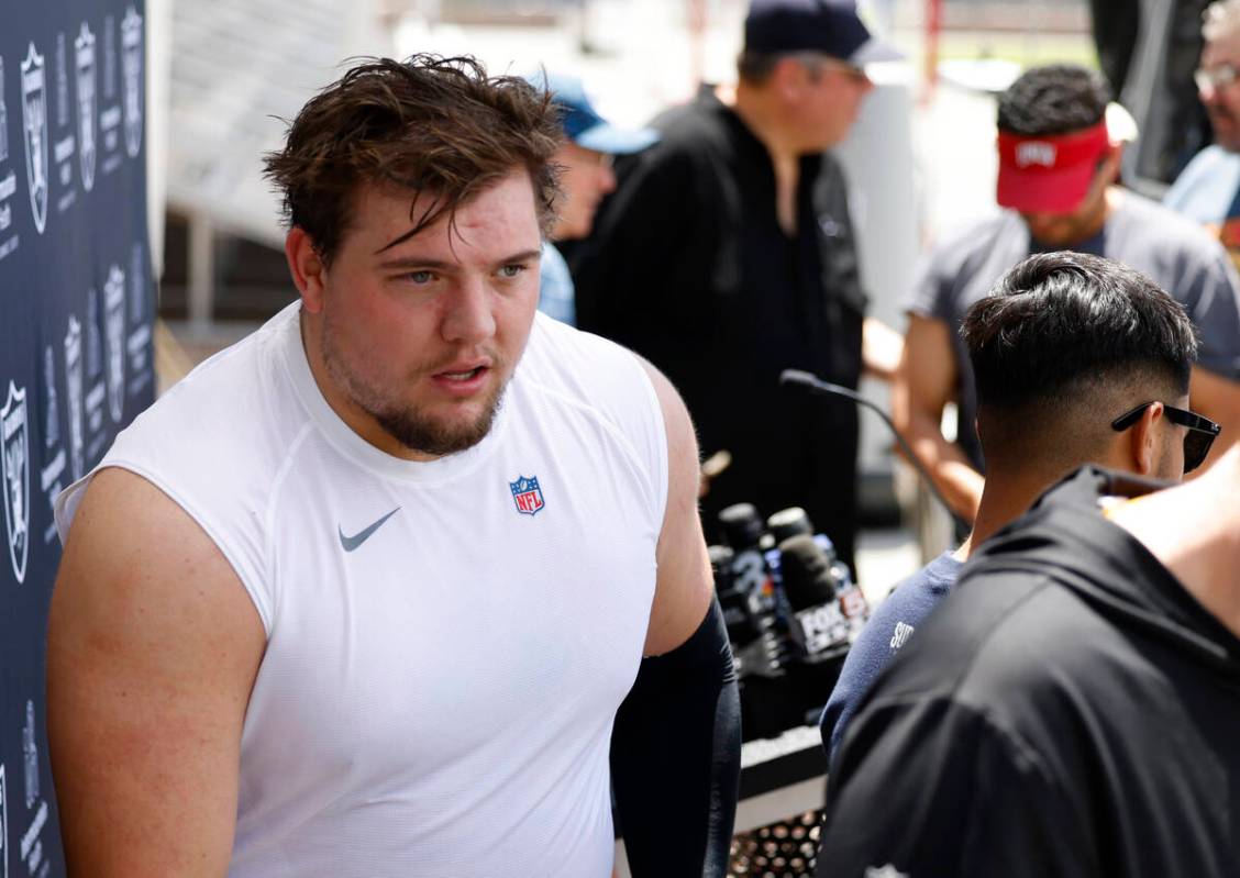 Raiders rookie guard Jackson Powers-Johnson smiles as he addresses the media after rookies firs ...