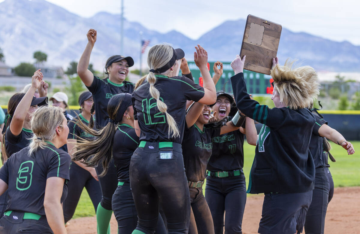 Palo Verde teammates celebrate receiving the winning plaque after defeating Coronado in their 5 ...