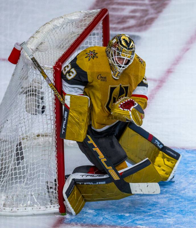 Golden Knights goaltender Adin Hill (33) curls up on a shot by the Dallas Stars during the seco ...