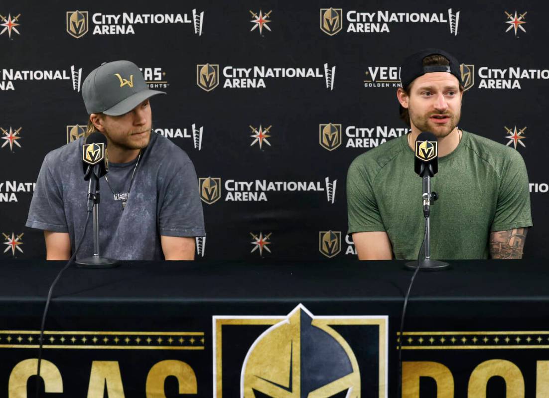 Golden Knights center William Karlsson, left, and goaltender Adin Hill listen to reporters ques ...