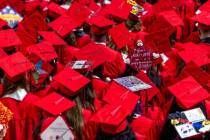 Graduates wear custom mortar boards during UNLV spring graduation commencement exercises at the ...
