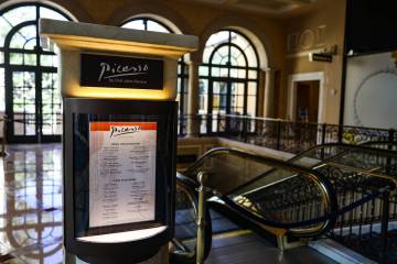 A menu is posted at the entrance to Picasso at the Bellagio hotel-casino in Las Vegas, Wednesda ...