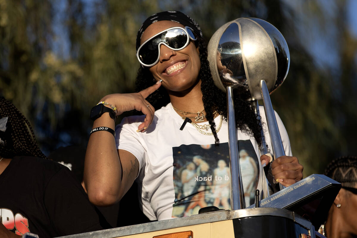 Las Vegas Aces forward A'ja Wilson parades down Las Vegas Boulevard with her team to celebrate ...