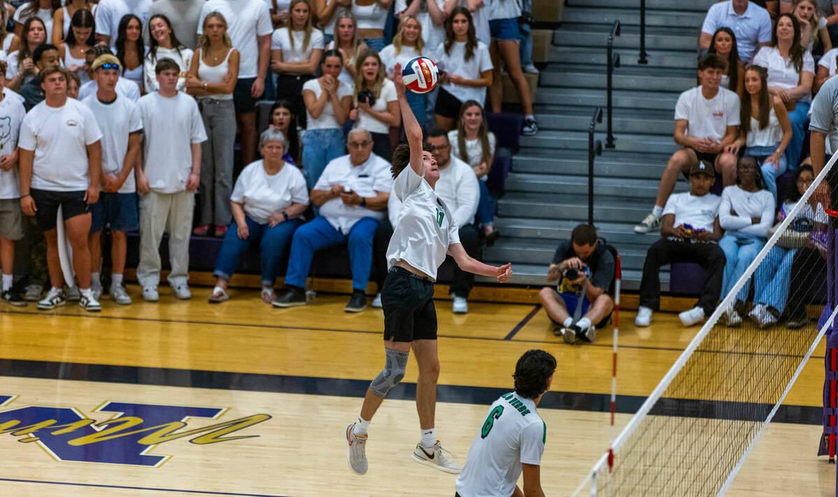 Palo Verde's Bridger McCoy (11) spikes the ball against Coronado during the Class 5A boy's voll ...