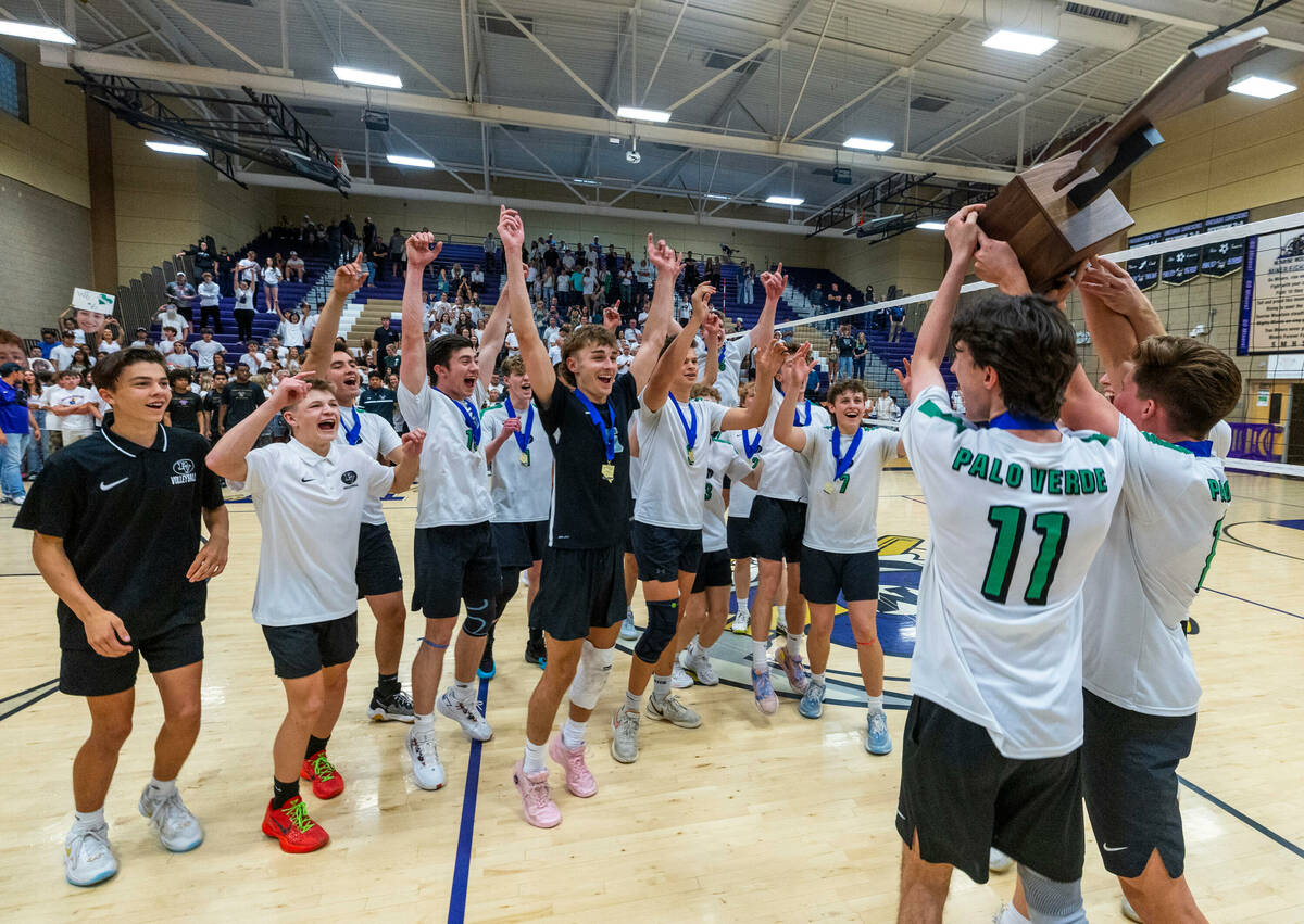 Palo Verde's players celebrate with the trophy after their match win against Coronado for the C ...