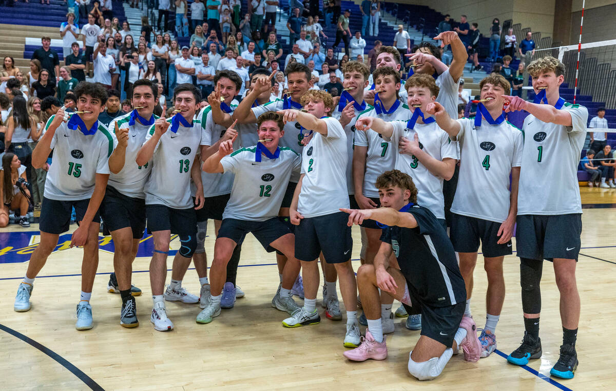 Palo Verde's players show off individual medals as they celebrate their match win against Coron ...