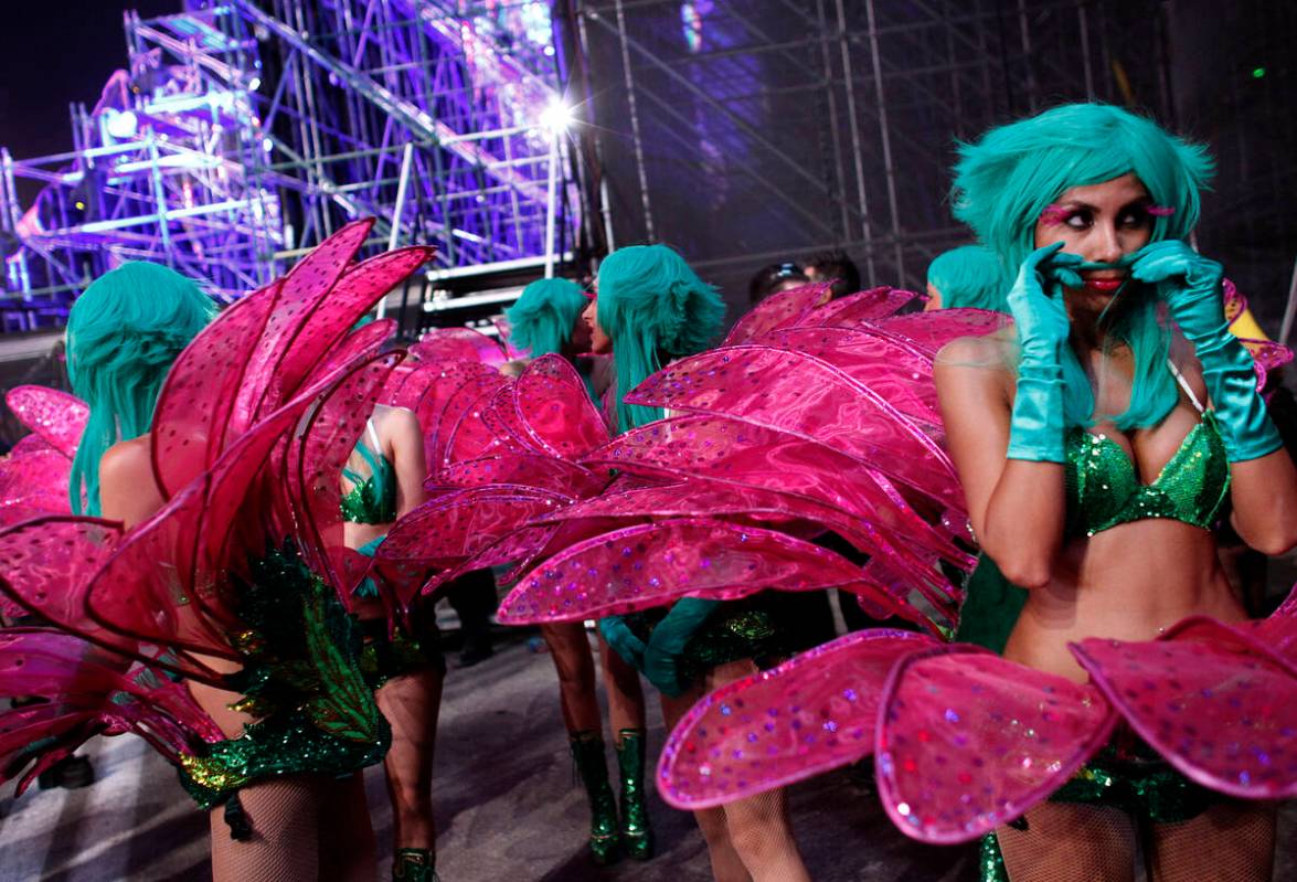 Dancers with the Flower Brigade wait backstage between performances during the Electric Daisy C ...