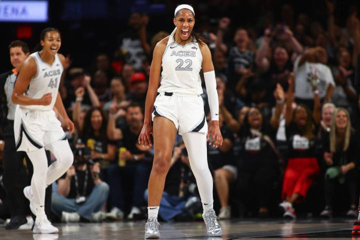 Las Vegas Aces center A'ja Wilson (22) celebrates after scoring and drawing a foul on the Phoen ...