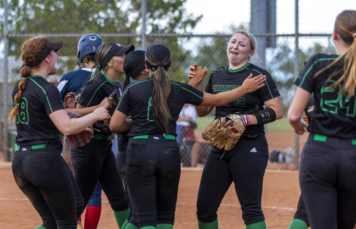 Palo Verde pitcher Bradi Odom (13) cries as teammates join her on the mound after defeating Cor ...