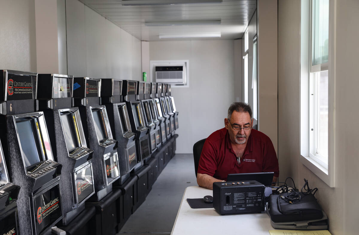 Joey Apicella, catch teams security manager for Century Gaming Technologies, works inside a tra ...