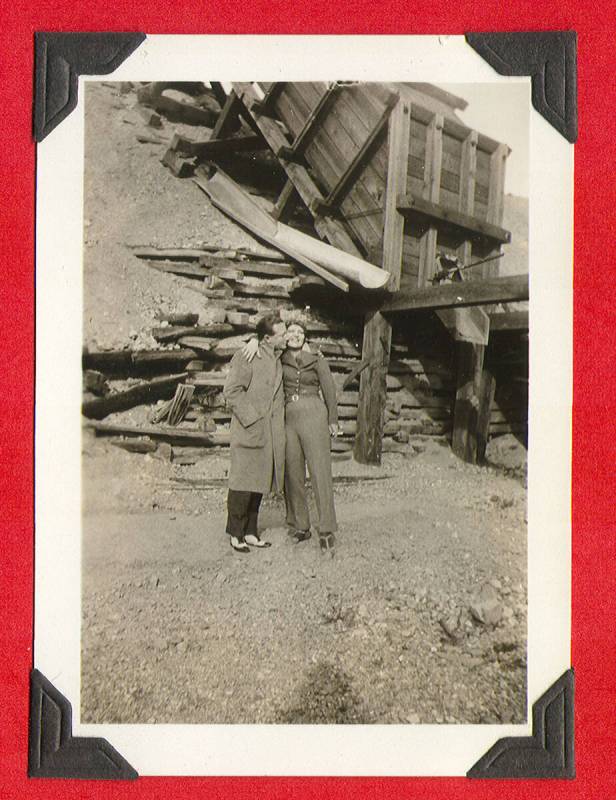 Clara Bow kissing an unidentified man (that is thought to be Rex Bell) outside of a mine shaft ...