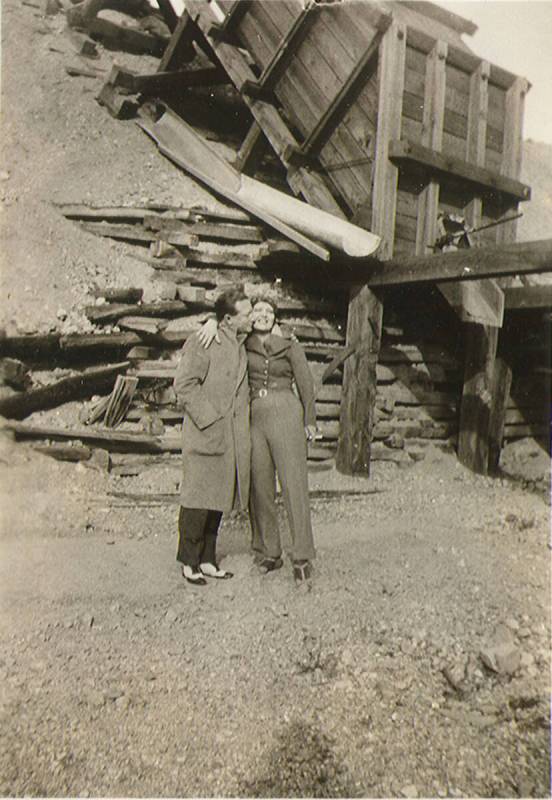 Clara Bow kissing an unidentified man (that is thought to be Rex Bell) outside of a mine shaft ...