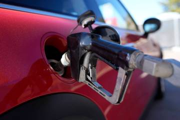 A motorist fills up the fuel tank of a vehicle at a Shell station Friday, Nov. 17, 2023, in thi ...