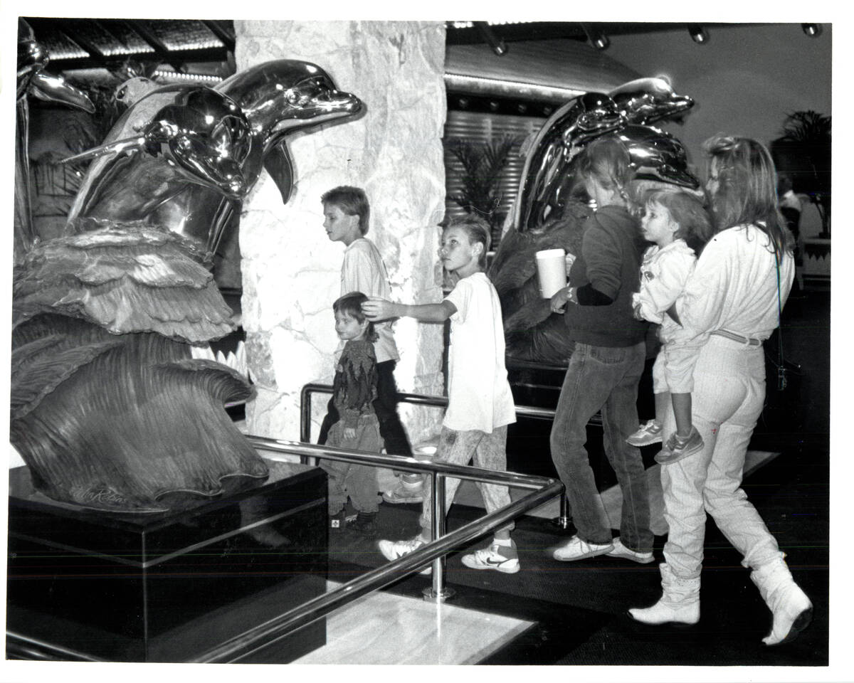Sculpted dolphins greet visitors at main entrance of Mirage Hotel and Casino November 22, 1989, ...
