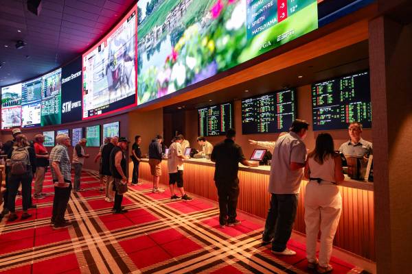 Guests line up to place bets at the newly renovated STN Sportsbook at Sunset Station hotel-casi ...