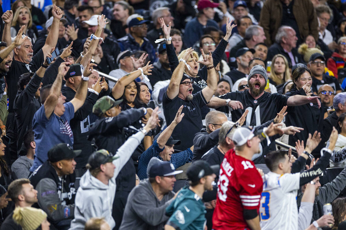 Raiders fans are pumped after another score against the Los Angeles Chargers during the first h ...