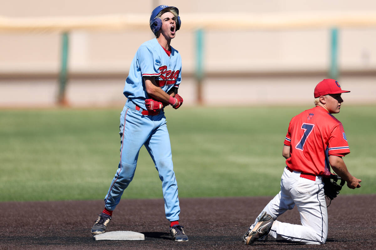 Reno pitcher Zackary Silverman (11) celebrates after hitting a double while Coronado shortstop ...