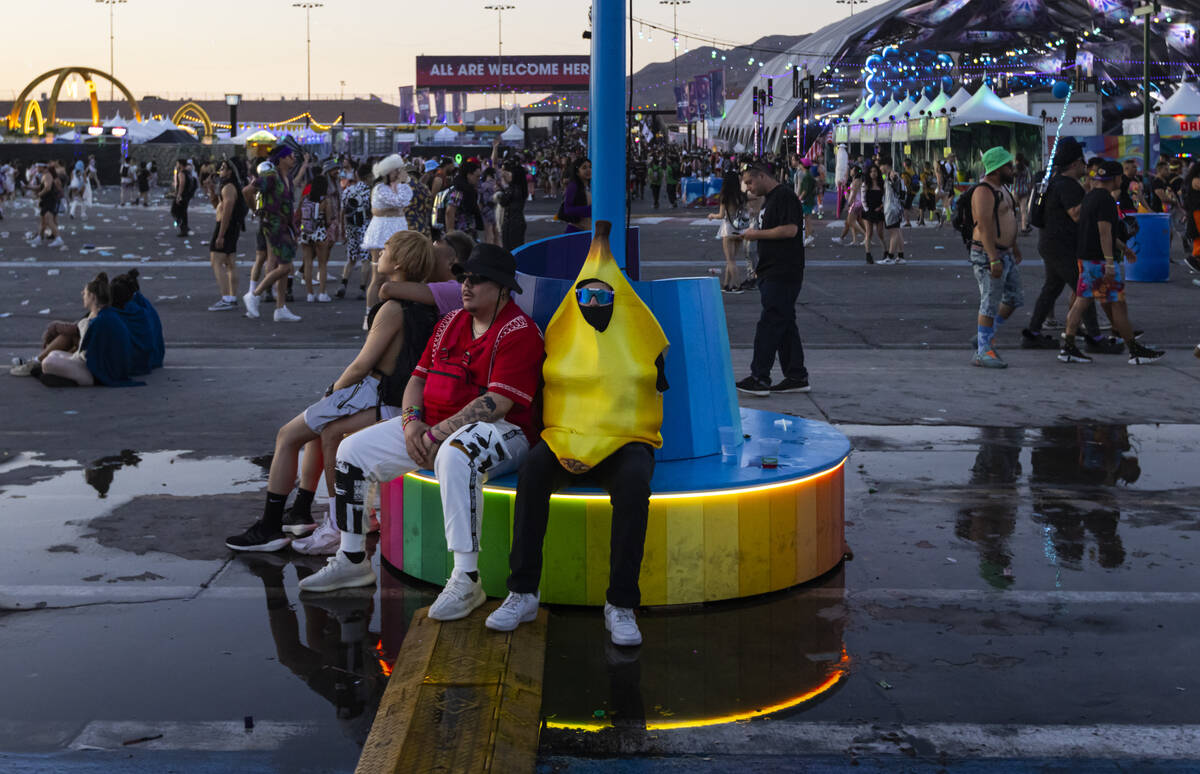 Festival attendees relax as the sun begins to rise during the second night of the Electric Dais ...