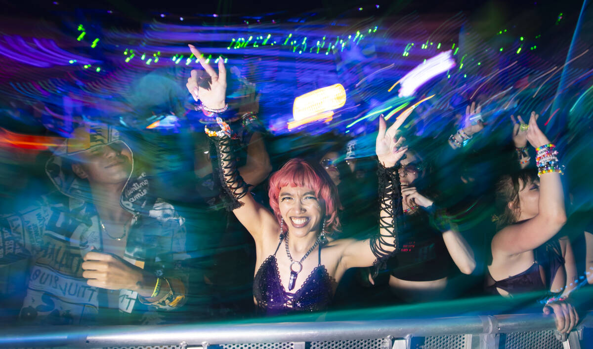 Attendees dance at the Cosmic Meadow stage during the second night of the Electric Daisy Carniv ...