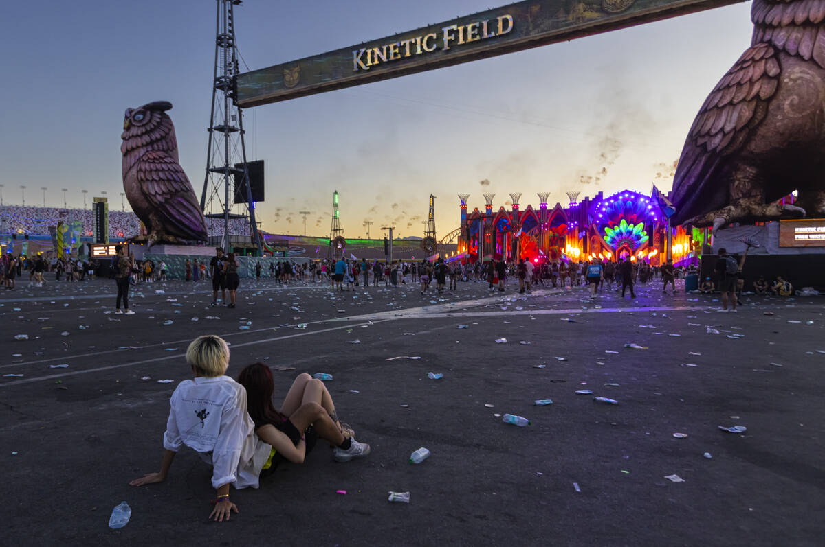 Festival attendees relax while watching Kinetic Field as the sun begins to rise during the seco ...