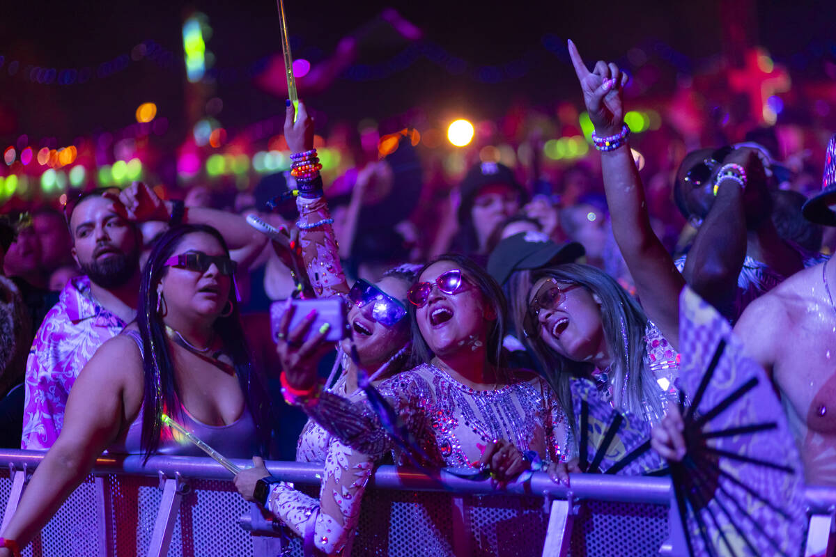 Festival attendees dance as Zedd performs at Kinetic Field during the second night of the Elect ...