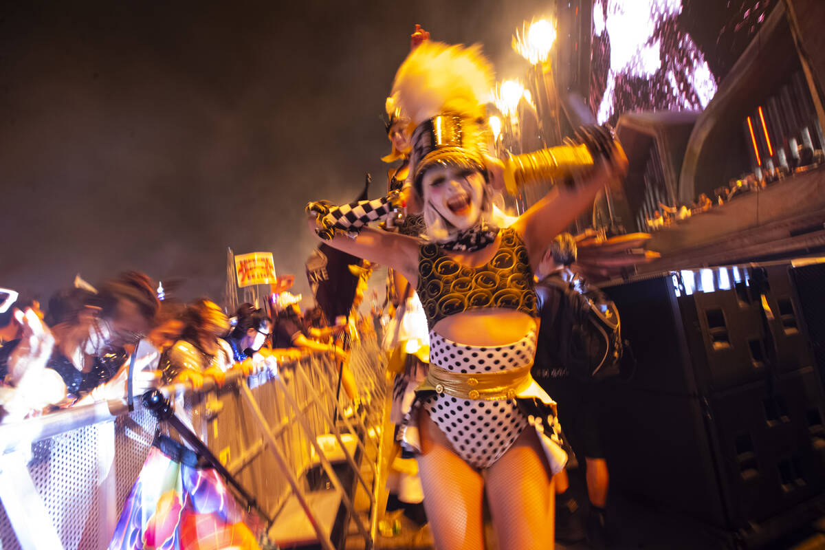 Costumed performers entertain the crowd at Kinetic Field during the second night of the Electri ...