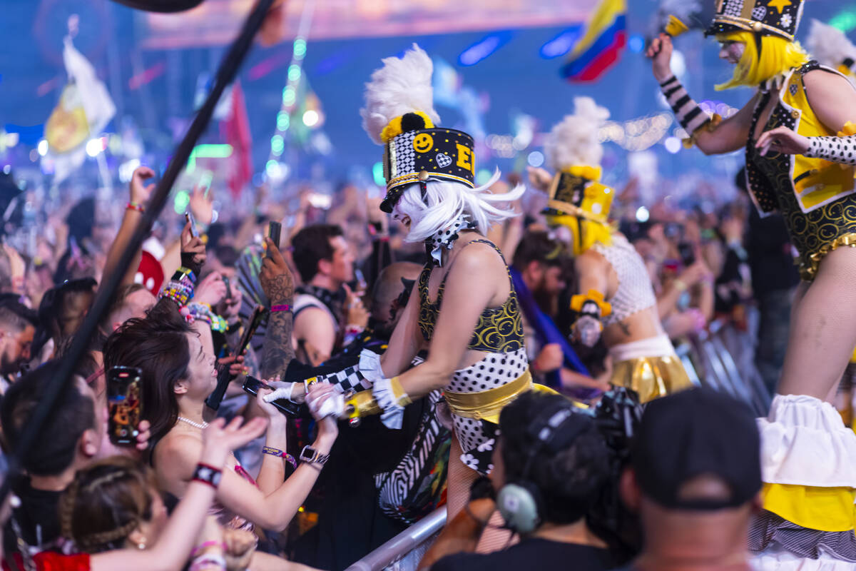 Costumed performers entertain the crowd at Kinetic Field during the second night of the Electri ...