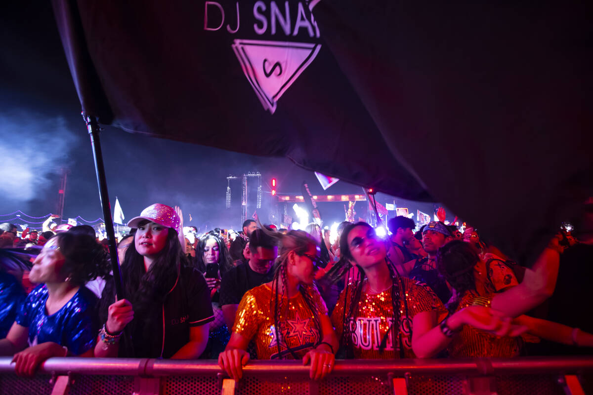 Festival attendees dance as DJ Snake performs at Kinetic Field during the second night of the E ...