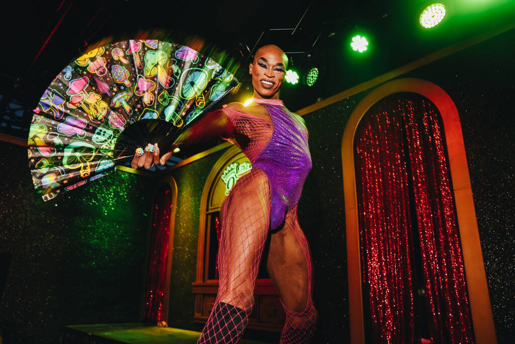 A dancer waves a fan during a performance at The Queen on the second day of the Electric Daisy ...