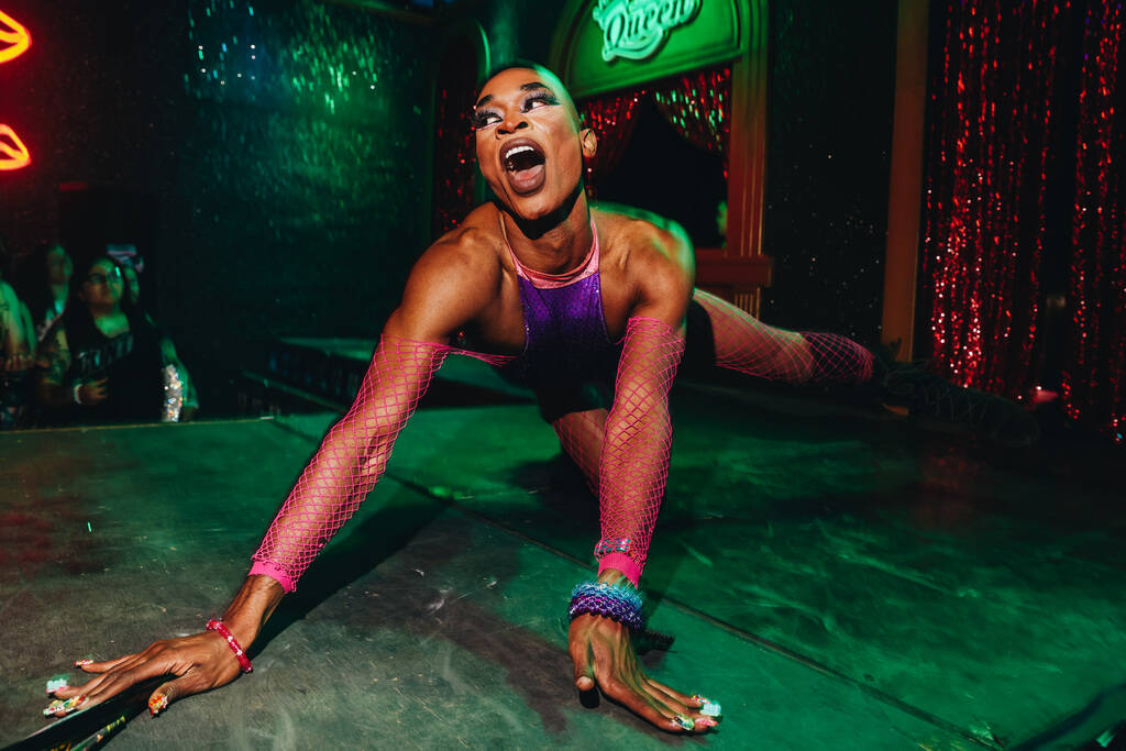 A dancer performs inside of The Queen during the second day of the Electric Daisy Carnival at t ...