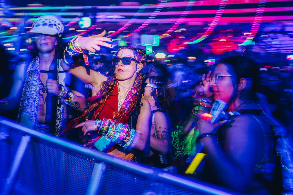 Festival attendees dance to a DJ set during the second day of the Electric Daisy Carnival at th ...