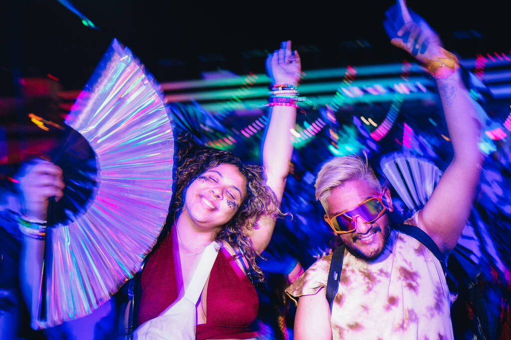 Festival attendees dance to a DJ set during the second day of the Electric Daisy Carnival at th ...