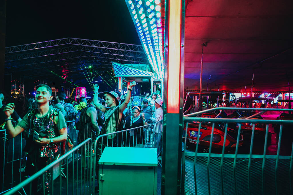 Festival attendees cheer as they exit a ride during the second day of the Electric Daisy Carniv ...