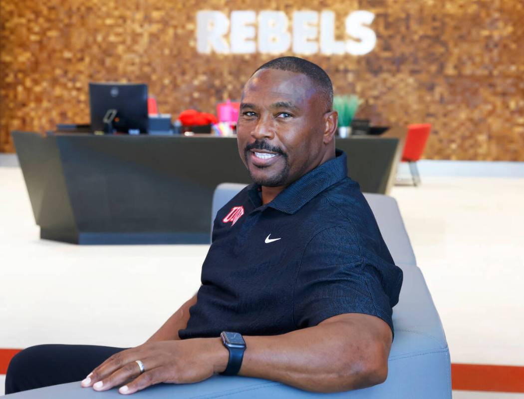 Former Rebel Hunkie Cooper, now a member of the staff, poses for a photo at Fertitta Football C ...