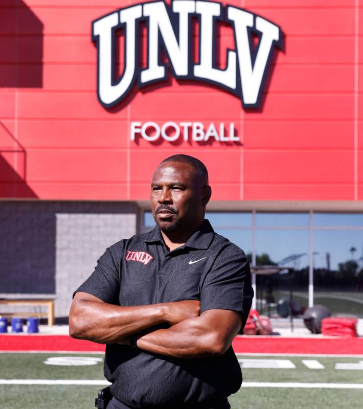 Former Rebel Hunkie Cooper, now a member of the staff, poses for a photo at Fertitta Football C ...