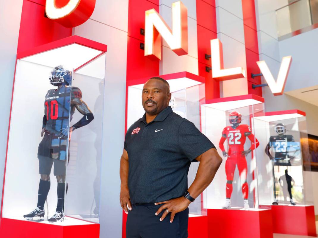 Former Rebel Hunkie Cooper, now a member of the staff, poses for a photo at Fertitta Football C ...