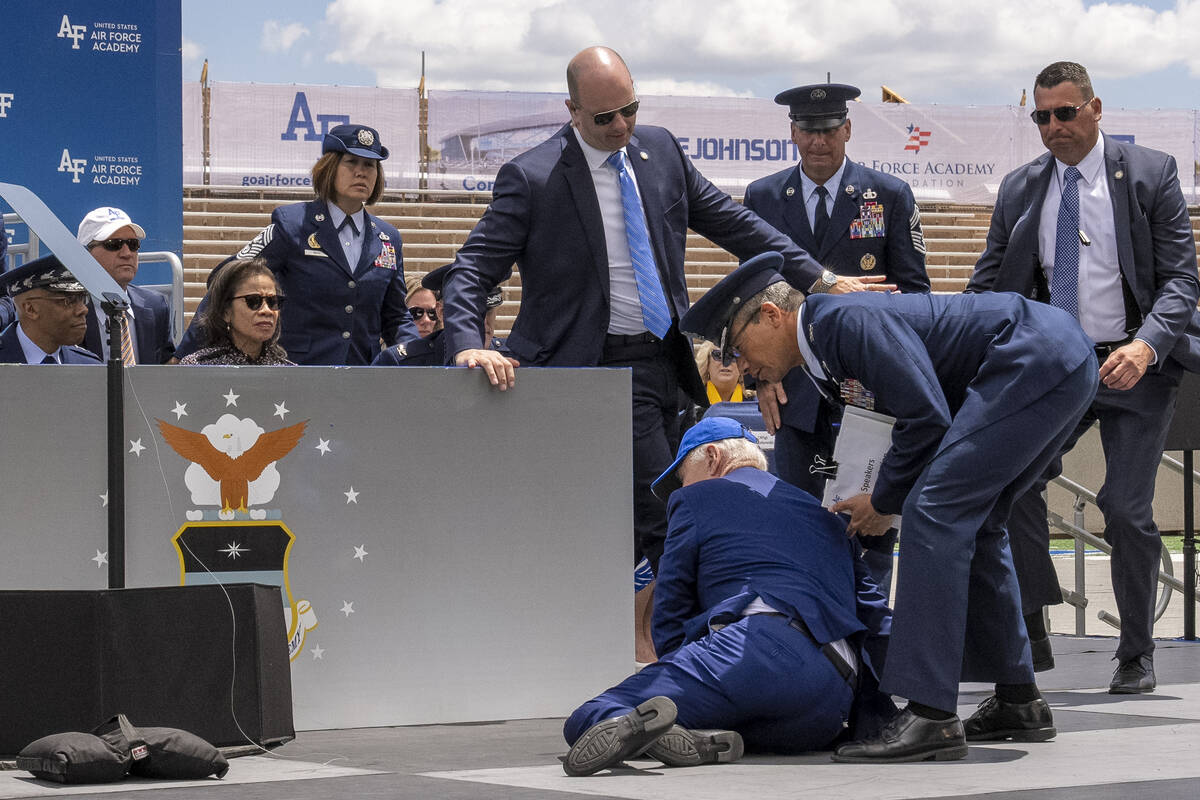 President Joe Biden falls on stage during the 2023 United States Air Force Academy Graduation C ...