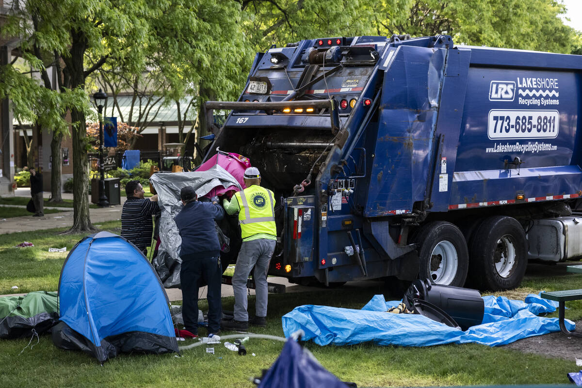 Crews disassemble the pro-Palestinian protest encampment in the quad at DePaul University's Lin ...