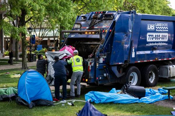 Crews disassemble the pro-Palestinian protest encampment in the quad at DePaul University's Lin ...