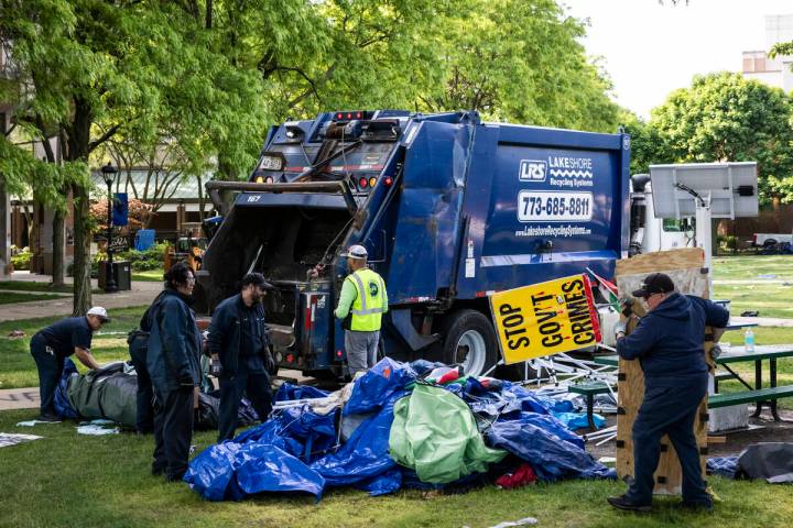 Crews disassemble the pro-Palestinian protest encampment in the quad at DePaul University's Lin ...