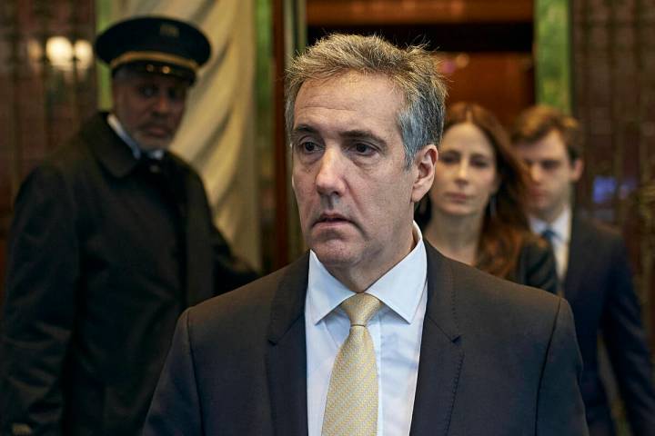 Michael Cohen departs his apartment building on his way to Manhattan criminal court, Thursday, ...