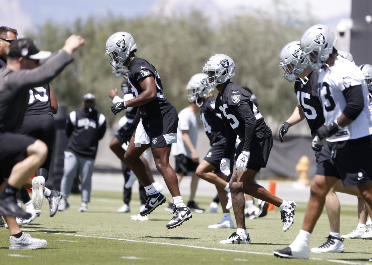 Raiders rookies, including cornerback Decamerion Richardson (25), warm up during rookies first ...