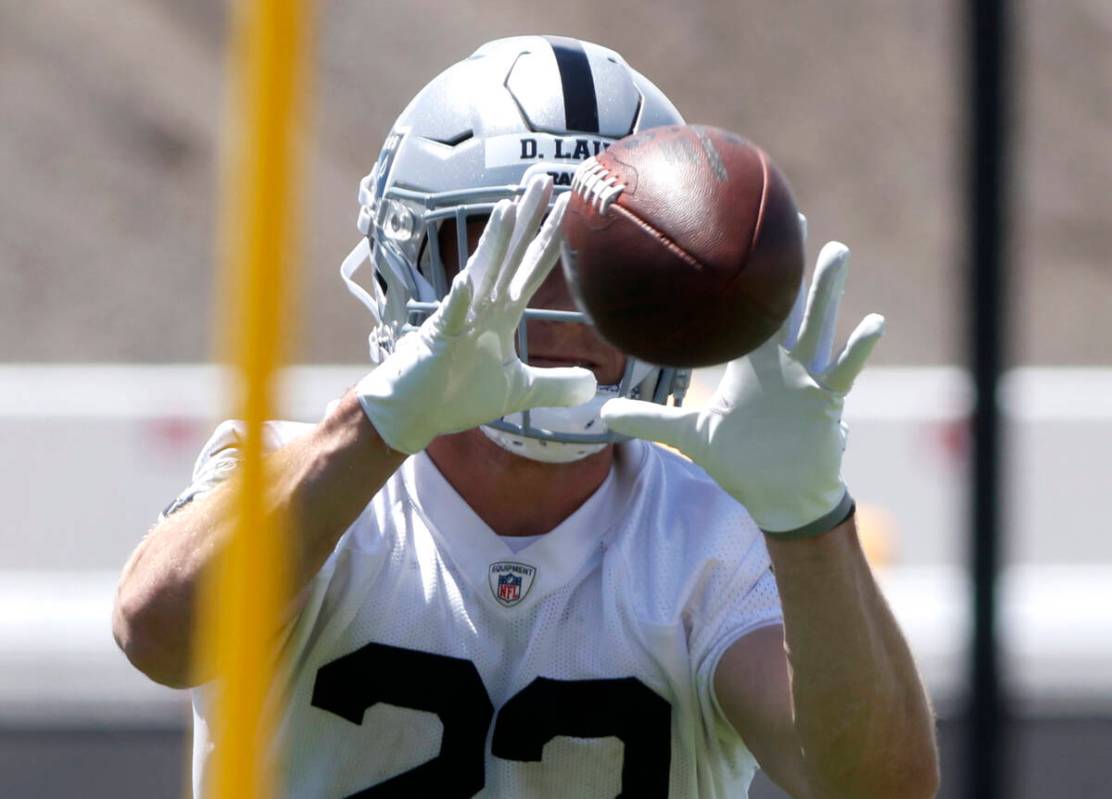 Raiders rookie running back Dylan Laube (23) catches the ball during rookies first day of pract ...